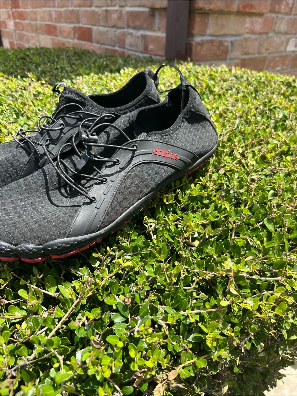 Men's Black Athletic Shoes with Red Accent - Slip-On Performance